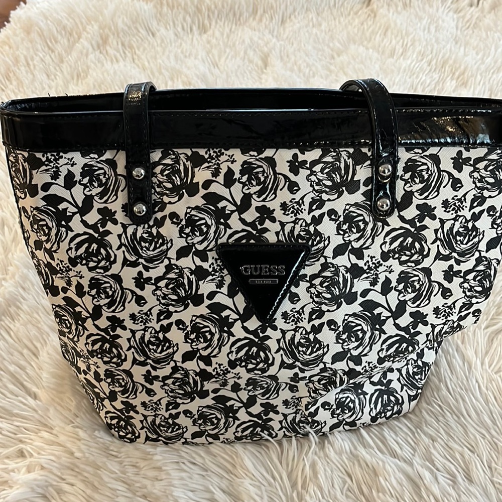 Guess shoulder bag black and cream flowers with black trim like new no scratches